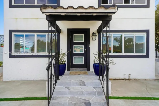 a front view of a house with a porch