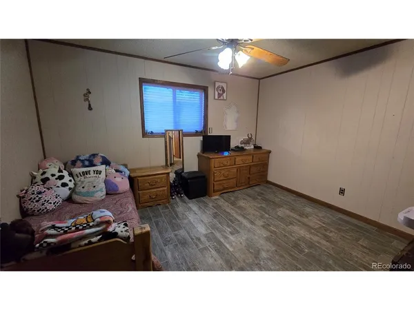 a room with furniture and a flat screen tv
