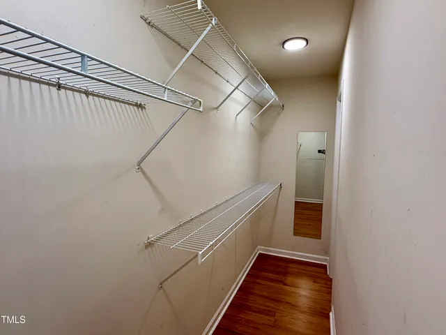 a view of a hallway with stairs