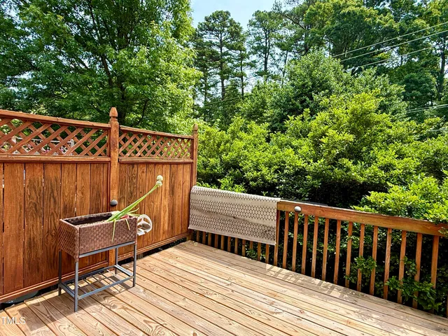 a view of a wooden deck with a bench