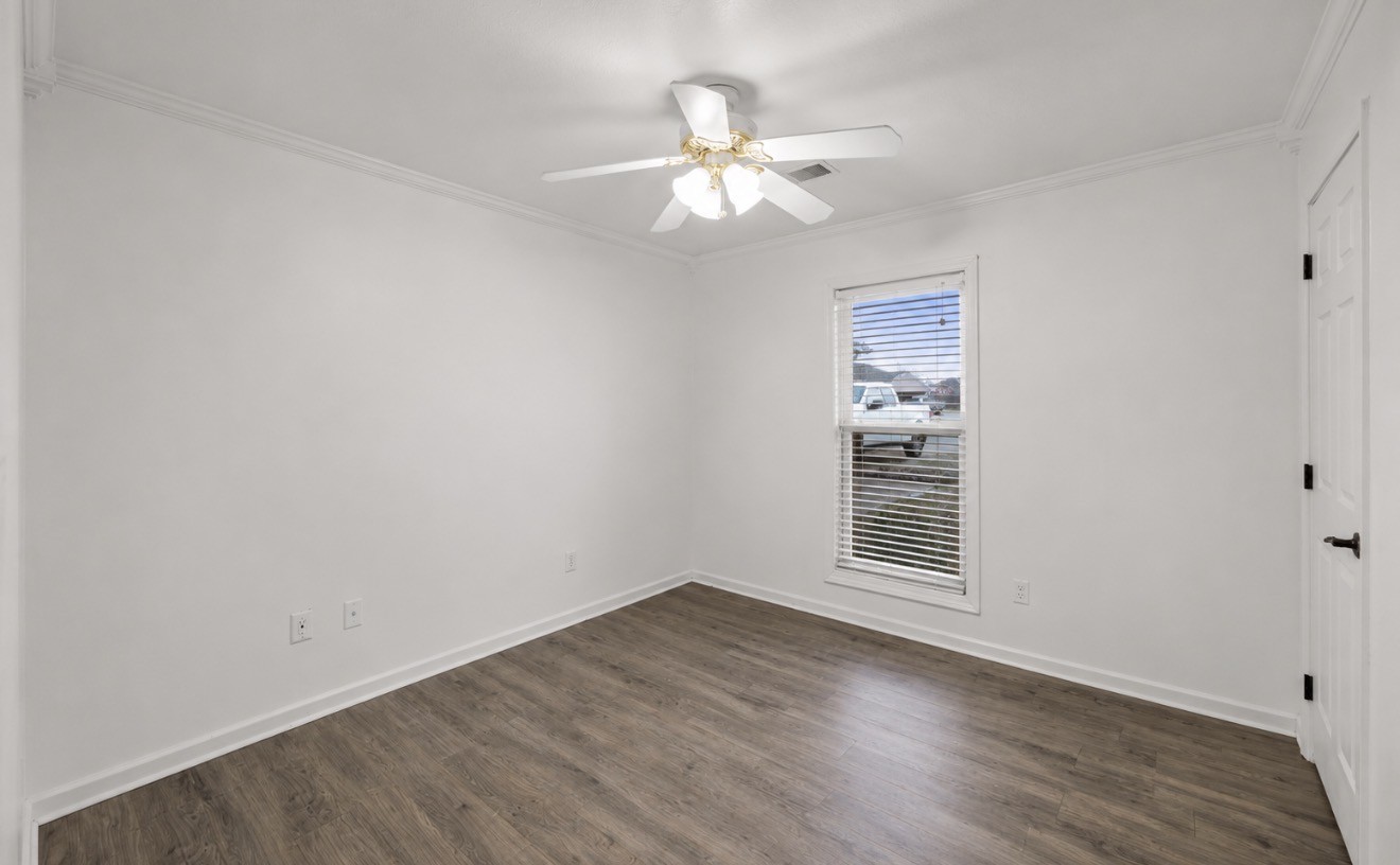 23 Matrix Cove Jackson, TN 38305 - Photo 13 of 16 wooden floor in an empty room with a window