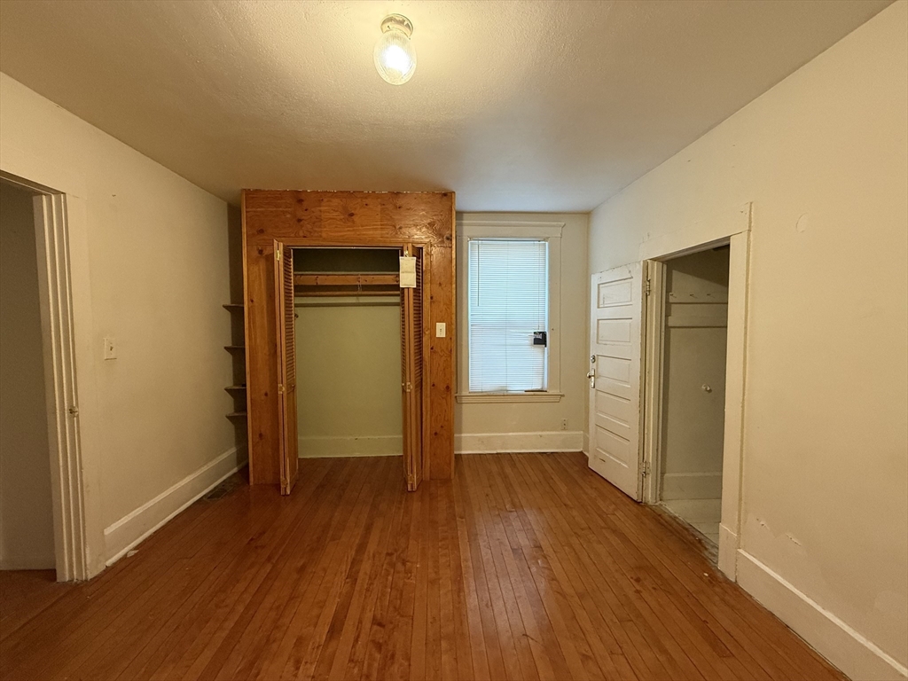 5 Stoneland Road Worcester, MA 01603 - Photo 18 of 41 a view of wooden floor in a room
