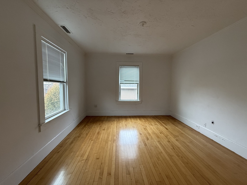 5 Stoneland Road Worcester, MA 01603 - Photo 23 of 41 a view of a room with wooden floors and window