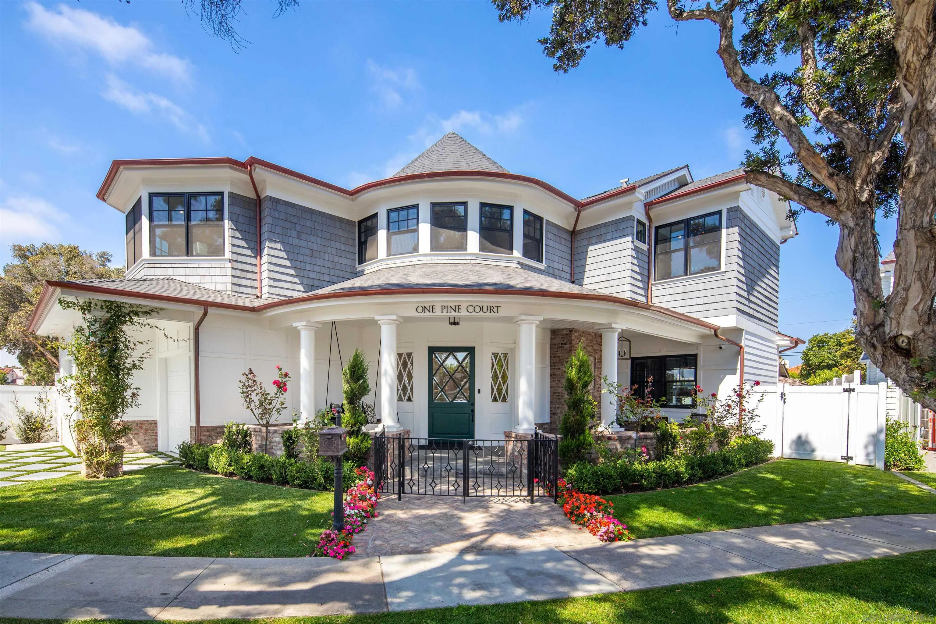 a front view of a house with garden