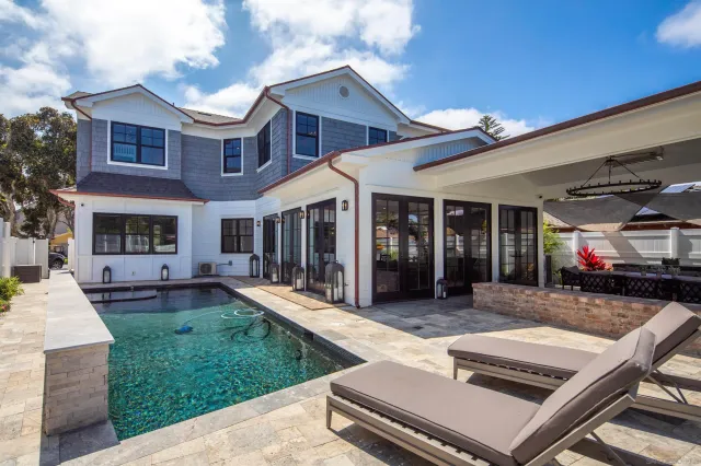 a view of a house with backyard porch and patio