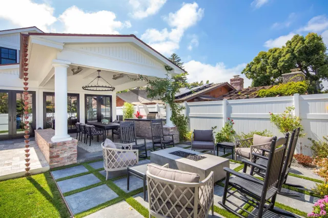 a view of a patio with table and chairs and potted plants
