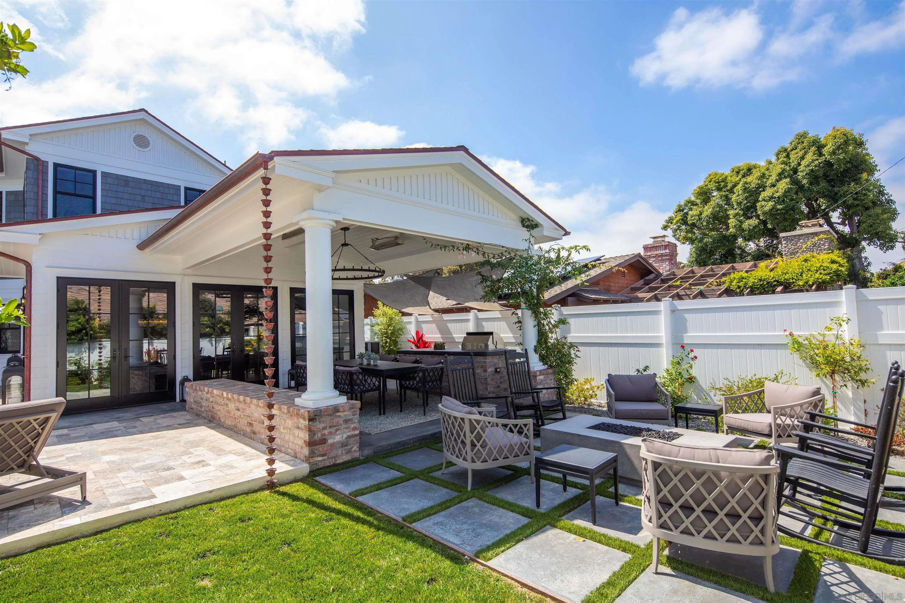 1 Pine Court Coronado, CA 92118 - Photo 14 of 46 a view of a backyard with a patio and outdoor seating