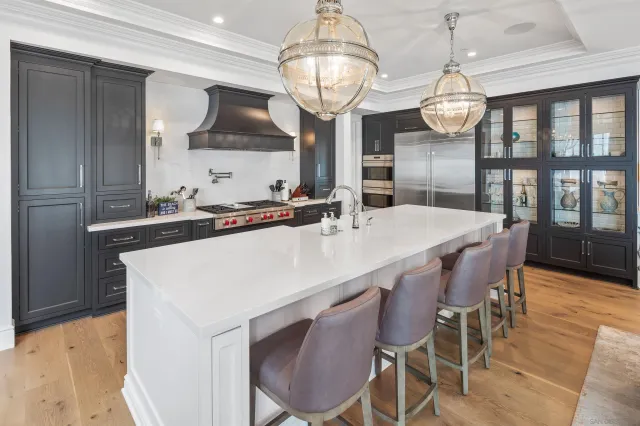 a kitchen with a dining table and chairs