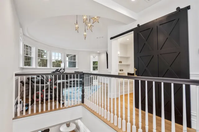 a view of bedroom with wooden floor