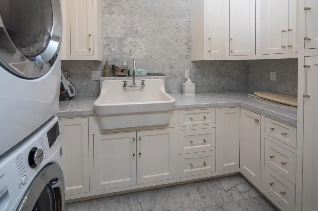 a utility room with cabinets
