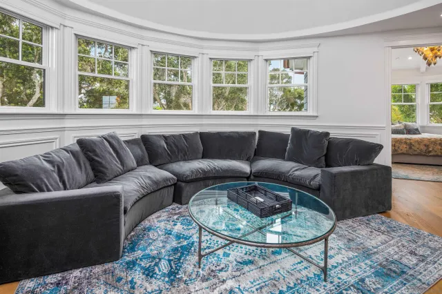 a living room with furniture and a window