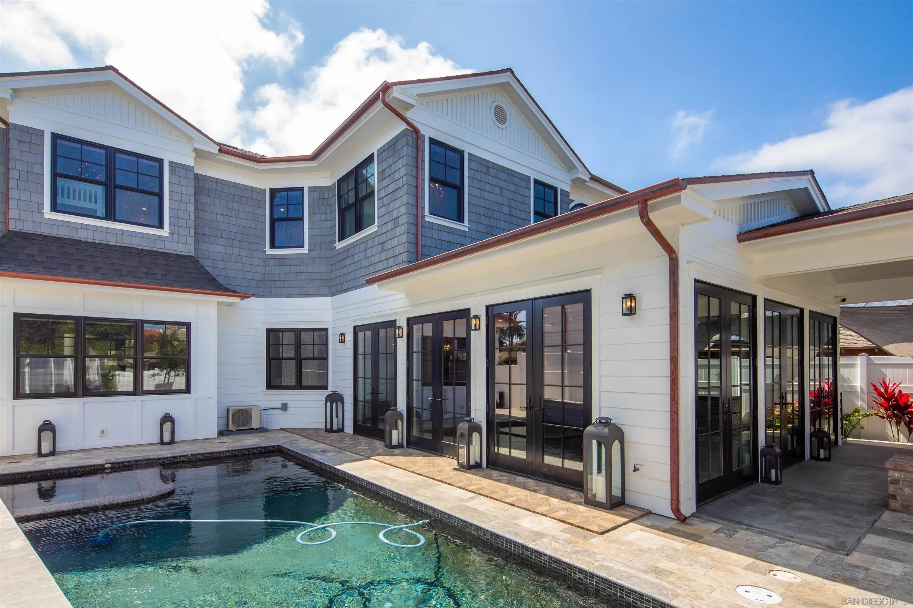 1 Pine Court Coronado, CA 92118 - Photo 10 of 46 a view of a house with a swimming pool and sitting area