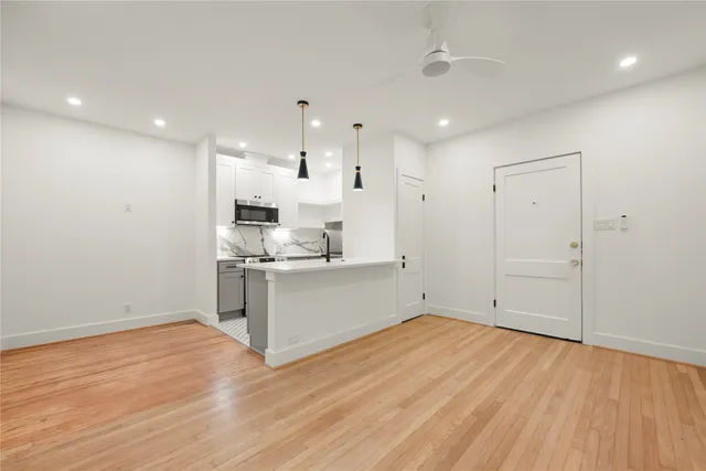 a view of kitchen with wooden floor