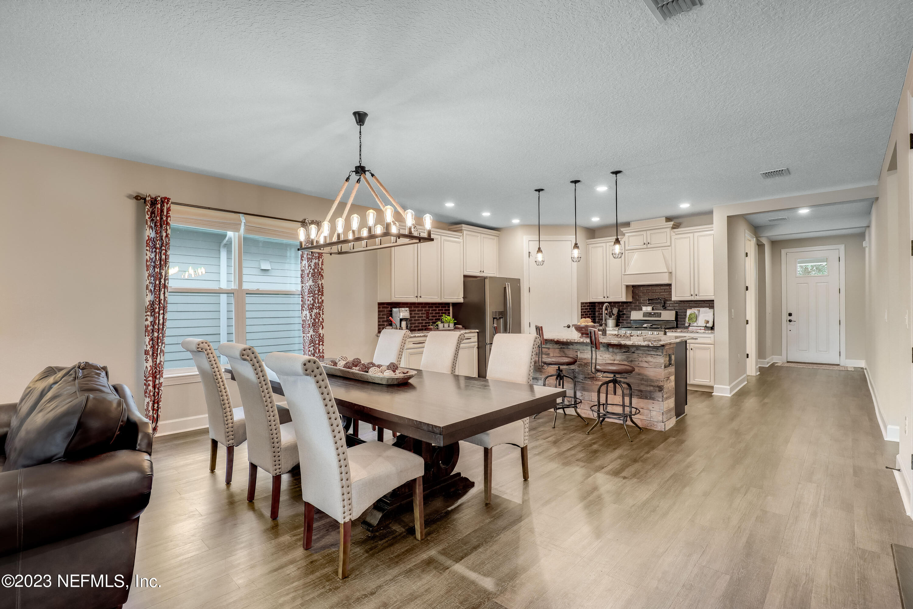 85248 Champlain Drive Fernandina Beach, FL 32034 - Photo 18 of 79 a view of a a dining room with furniture window and wooden floor