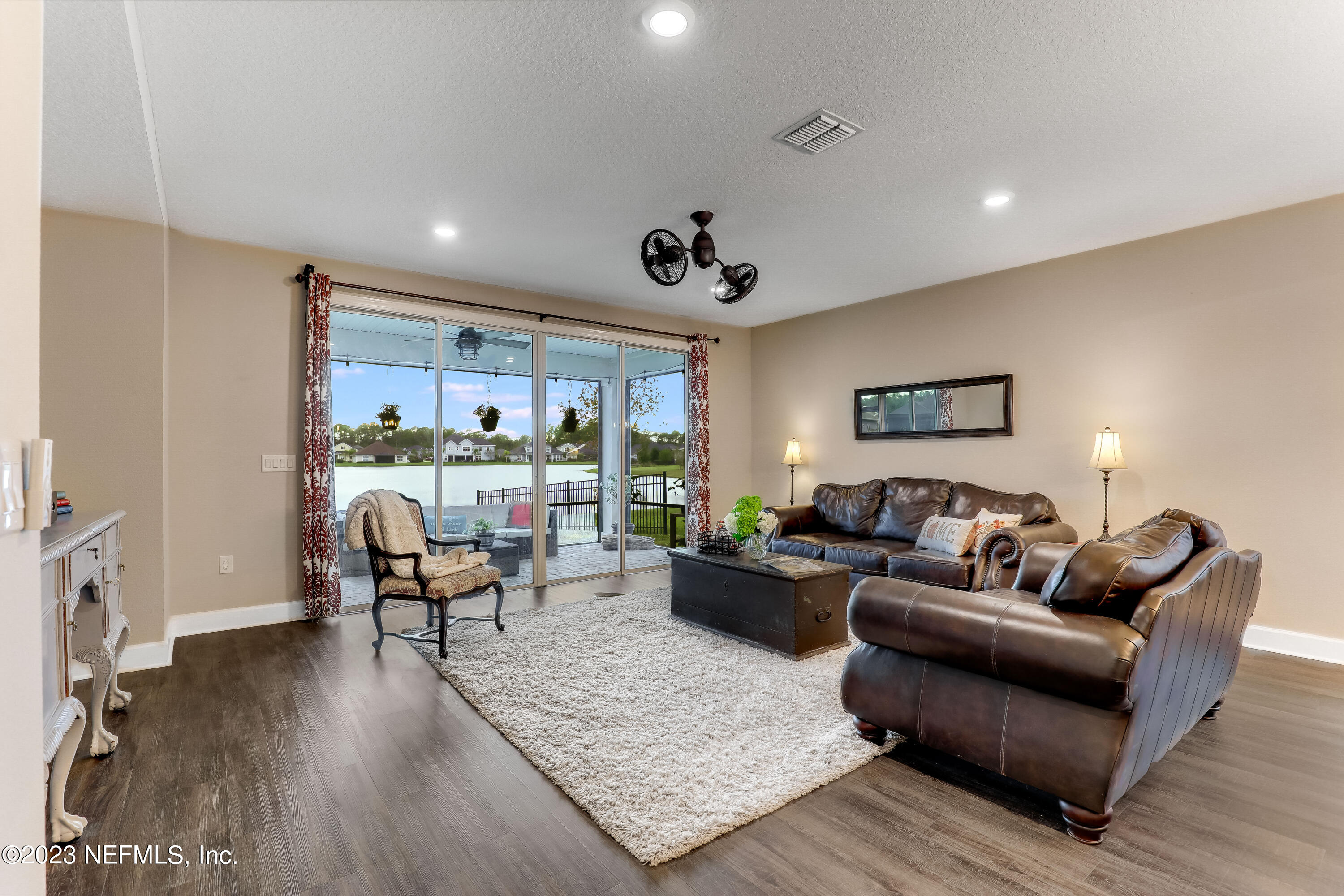 85248 Champlain Drive Fernandina Beach, FL 32034 - Photo 20 of 79 a living room with furniture and a wooden floor