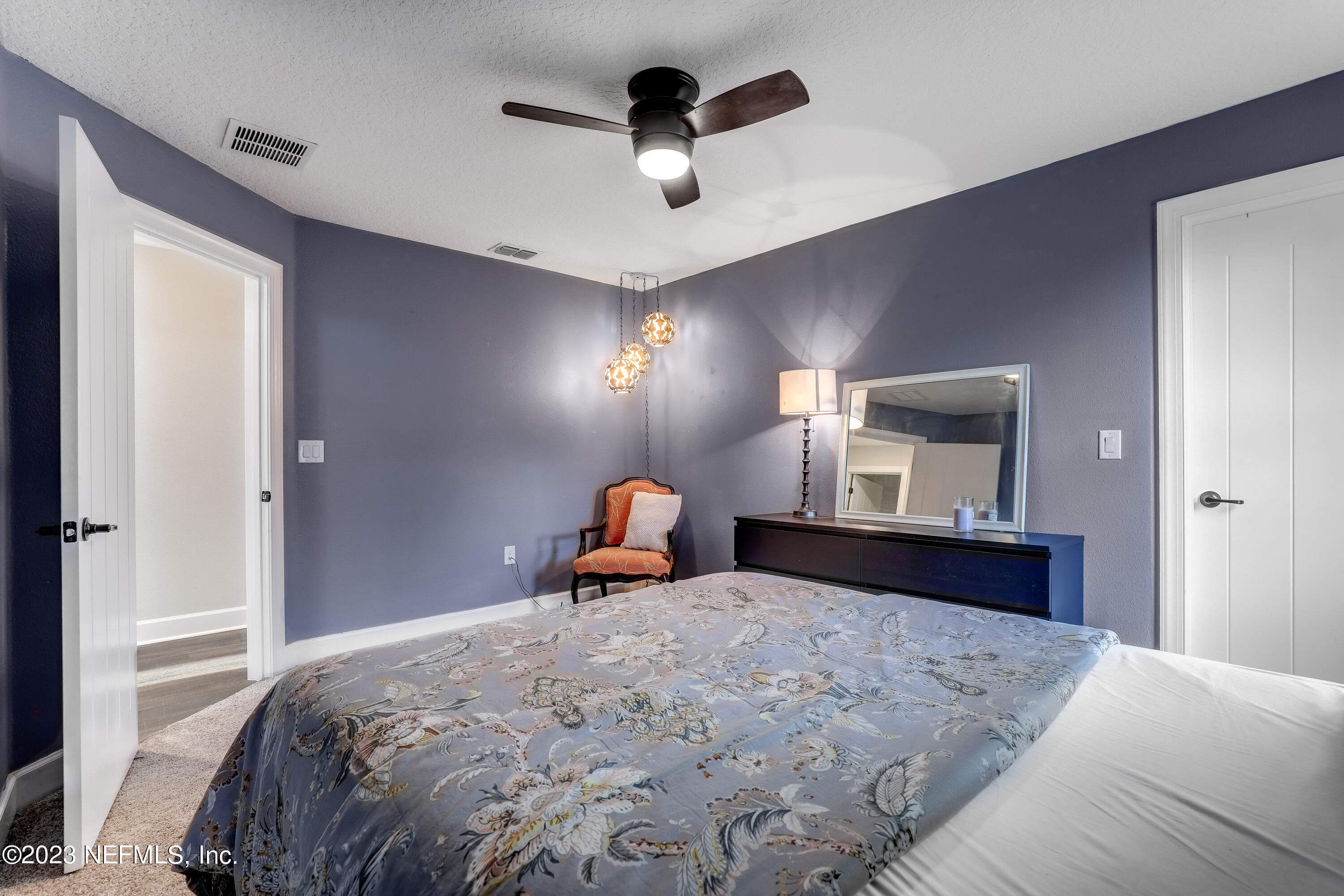 85248 Champlain Drive Fernandina Beach, FL 32034 - Photo 31 of 79 a bedroom with a bed and a dresser