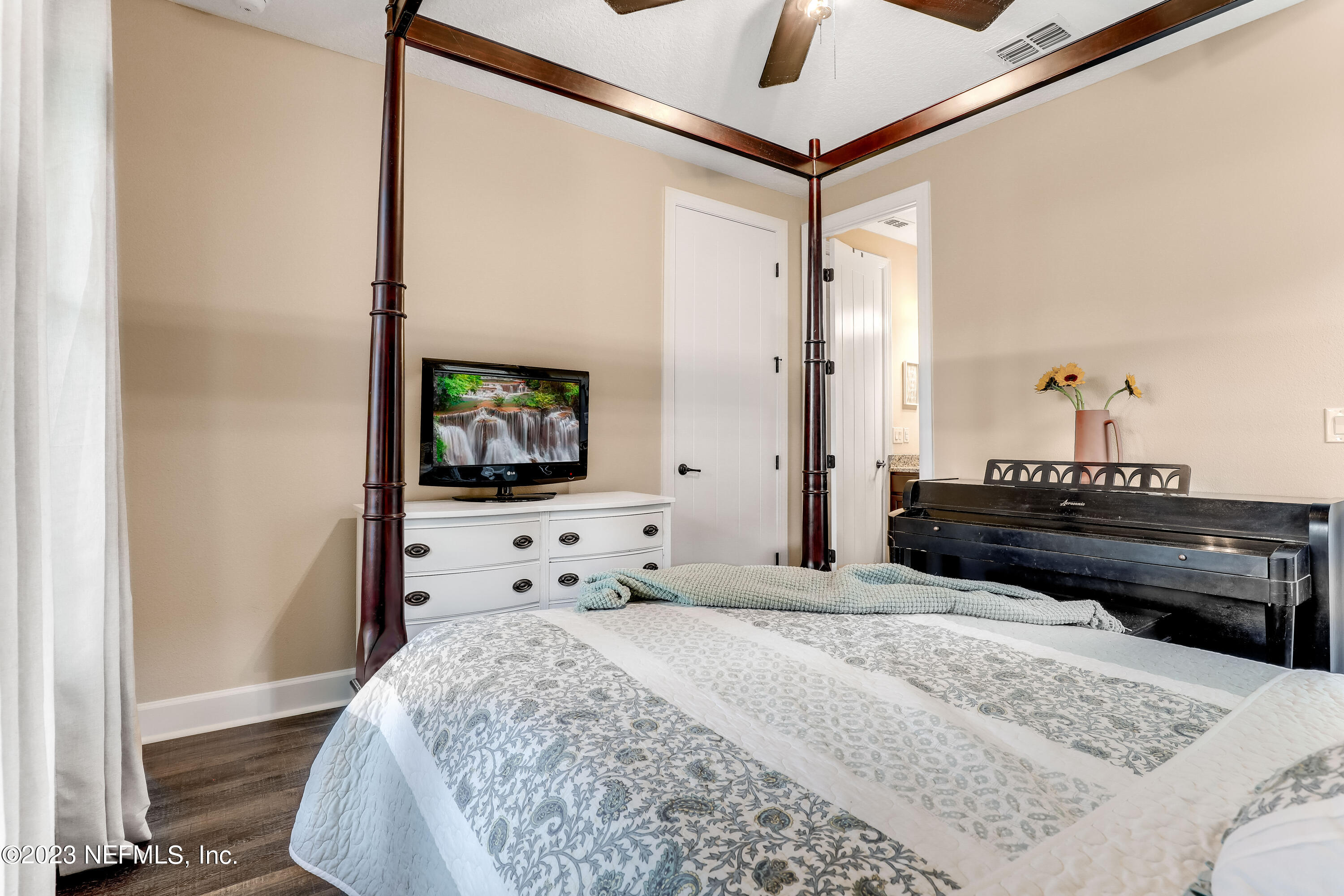 85248 Champlain Drive Fernandina Beach, FL 32034 - Photo 36 of 79 a bedroom with a bed and a flat screen tv