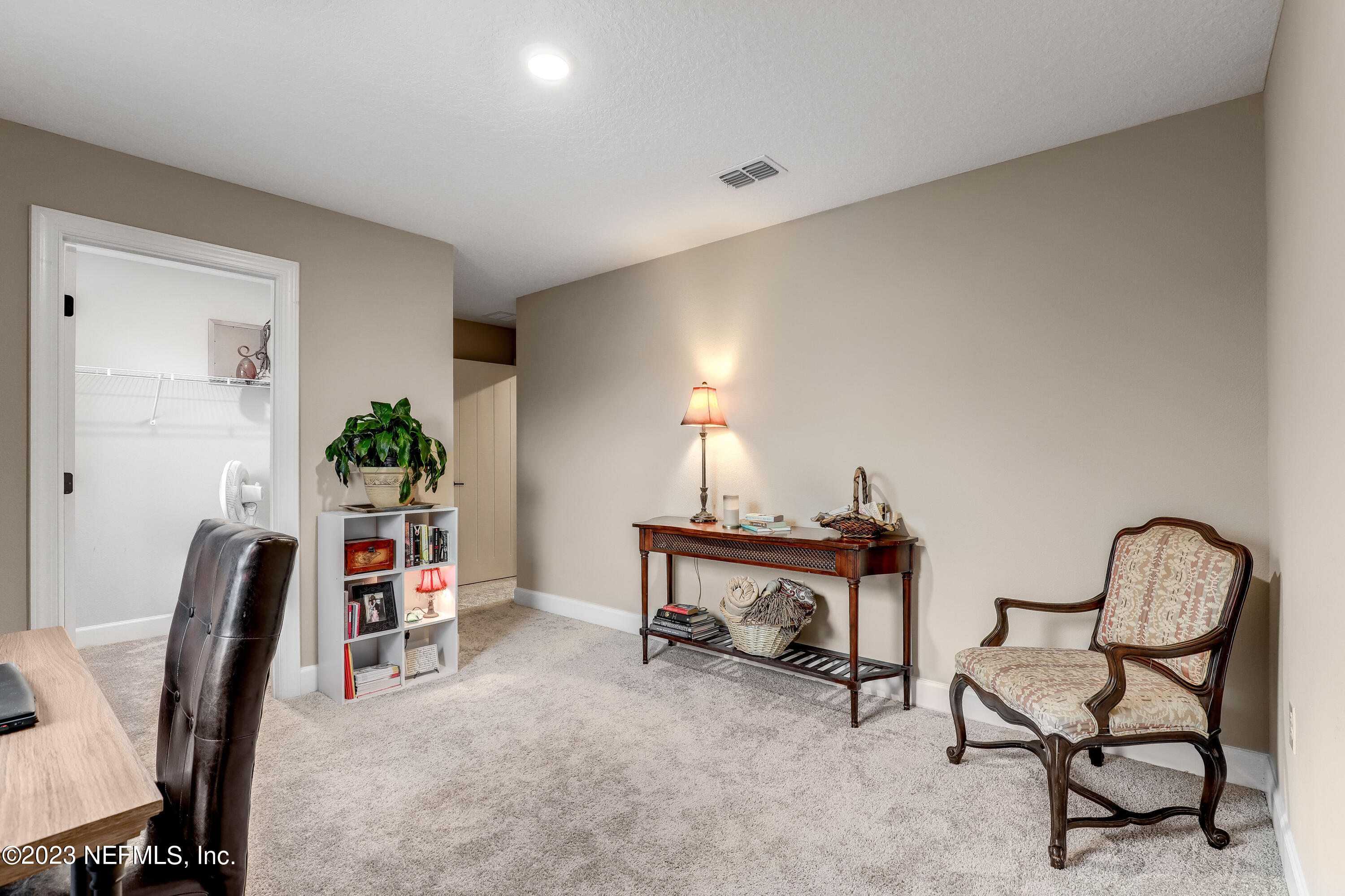 85248 Champlain Drive Fernandina Beach, FL 32034 - Photo 39 of 79 a view of a workspace with furniture and a potted plant