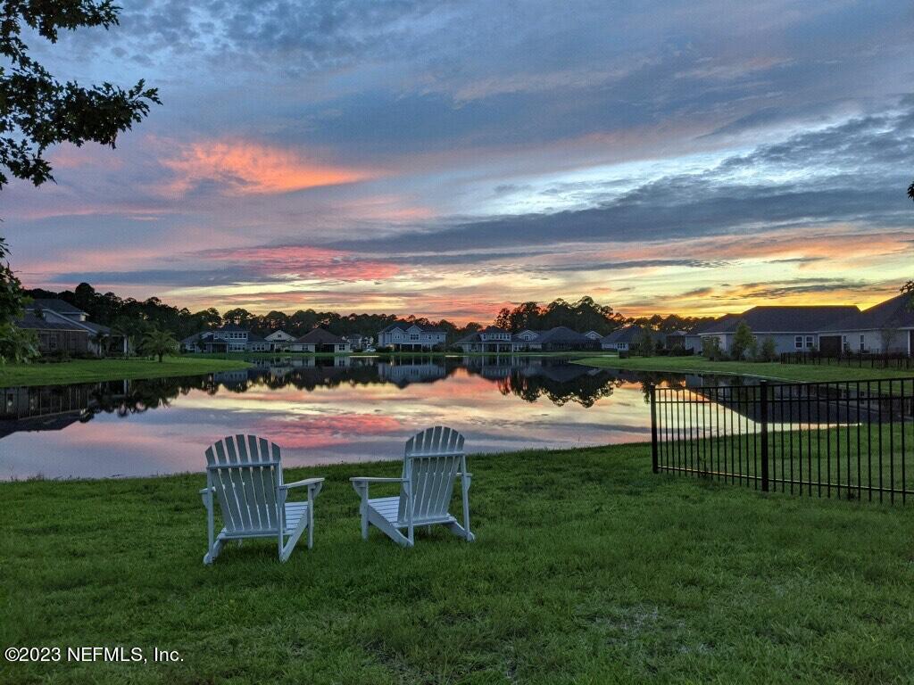 85248 Champlain Drive Fernandina Beach, FL 32034 - Photo 53 of 79 a view of a swimming pool and table and chairs in the garden