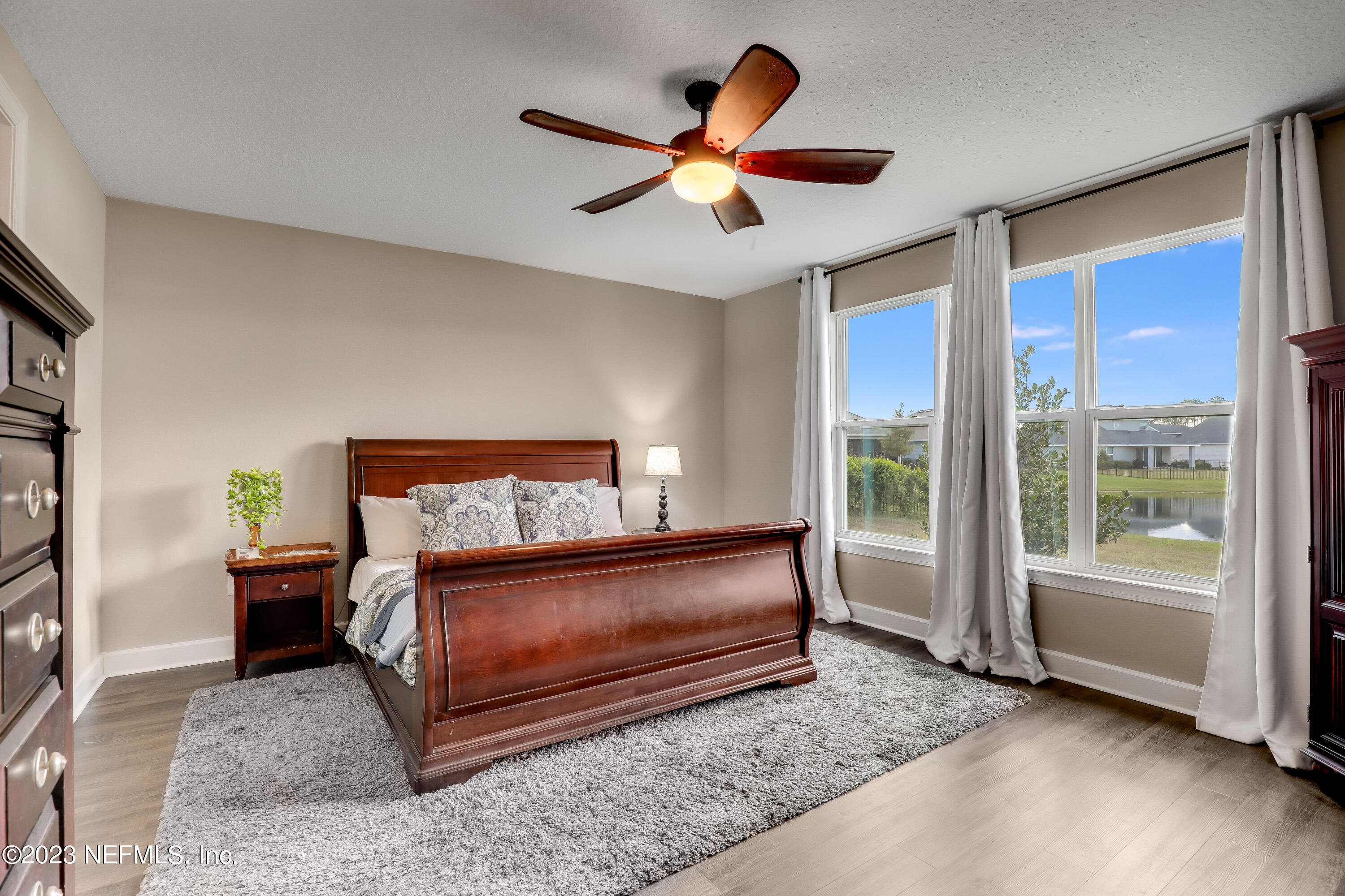 85248 Champlain Drive Fernandina Beach, FL 32034 - Photo 7 of 79 a bedroom with a bed and a large window