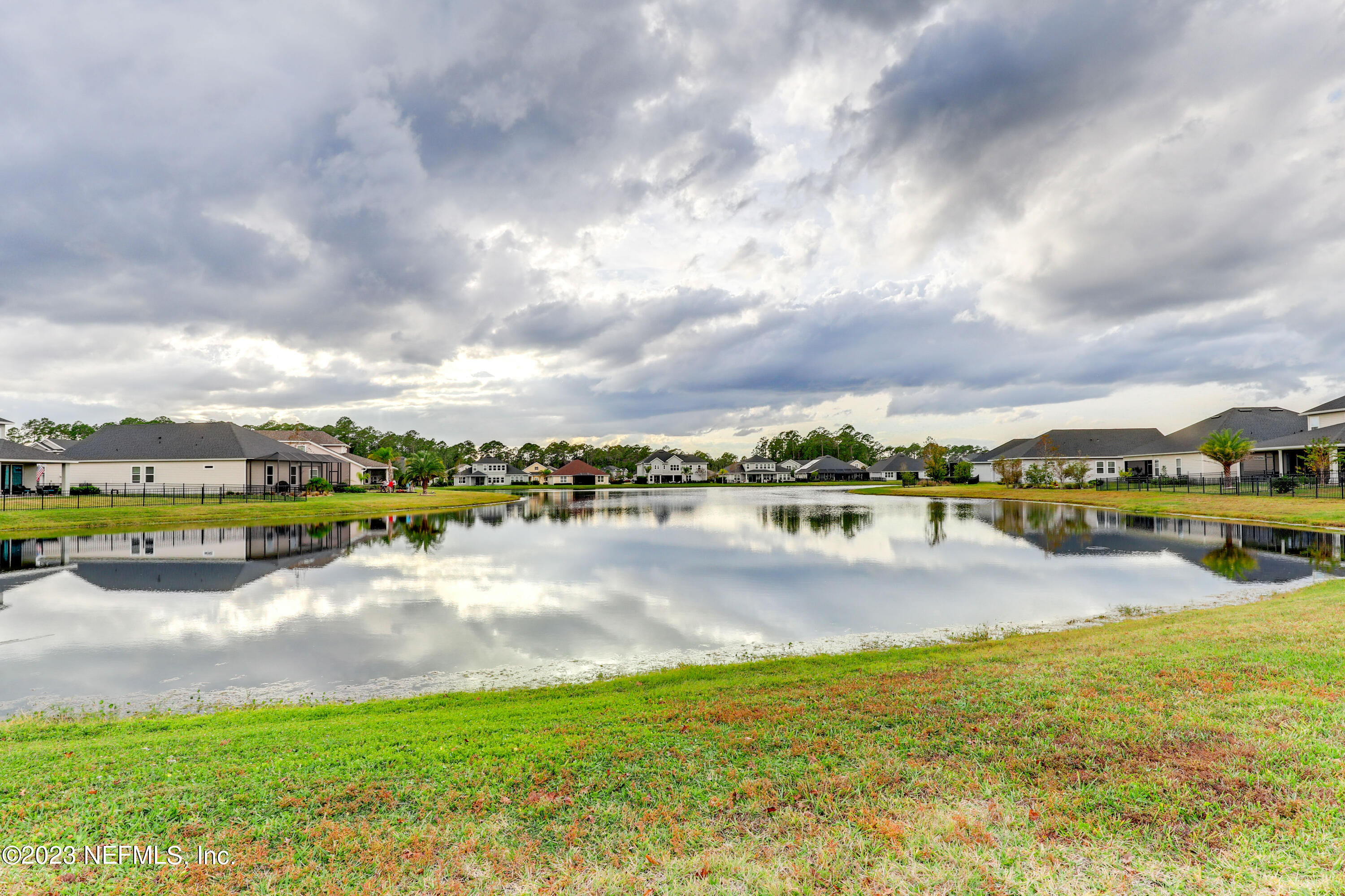 85248 Champlain Drive Fernandina Beach, FL 32034 - Photo 70 of 79 a view of a lake with houses in the back
