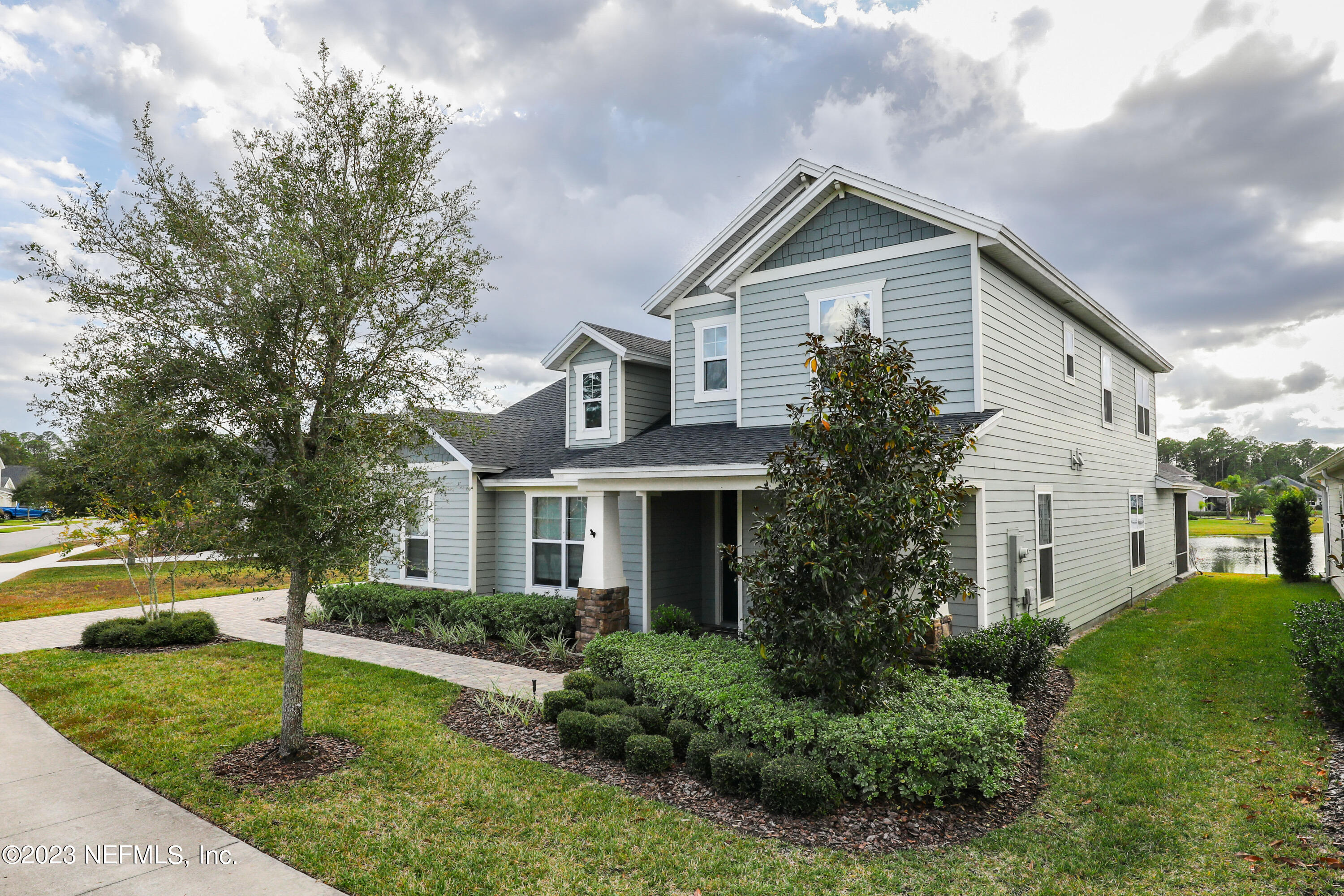 85248 Champlain Drive Fernandina Beach, FL 32034 - Photo 73 of 79 a front view of a house with a yard