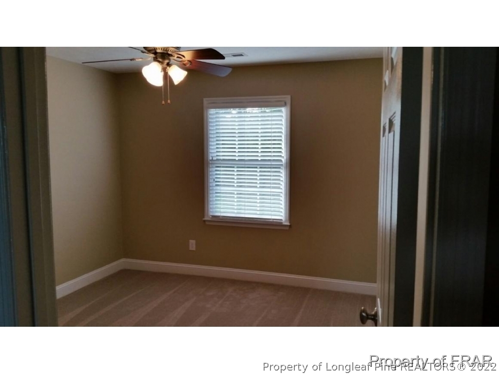 5265 Stewart Road Wade, NC 28395 - Photo 15 of 26 a black and white photo of a living room