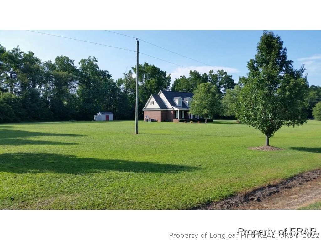 5265 Stewart Road Wade, NC 28395 - Photo 2 of 26 a view of a house with a park