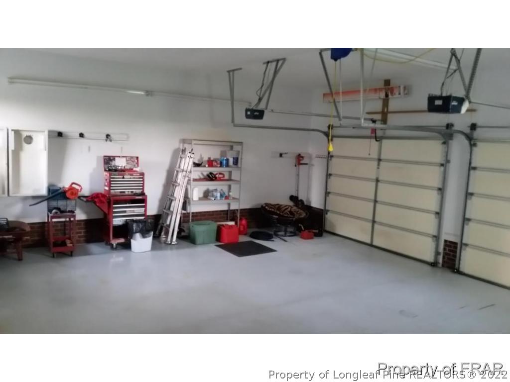 5265 Stewart Road Wade, NC 28395 - Photo 23 of 26 a black and white view of a garage