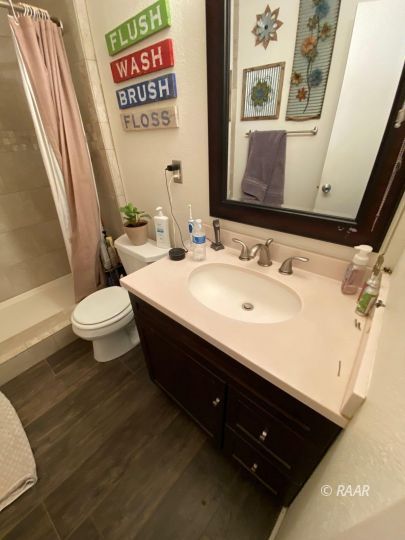 224 West Benson Avenue Ridgecrest, CA 93555 - Photo 3 of 6 a bathroom with a sink and a mirror