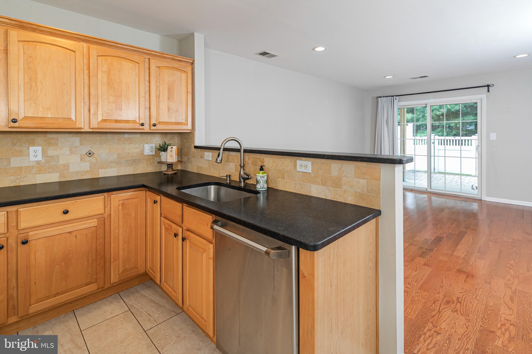 371 Watkins Road Pennington, NJ 08534 - Photo 11 of 42 a kitchen with stainless steel appliances granite countertop a sink and a white cabinets