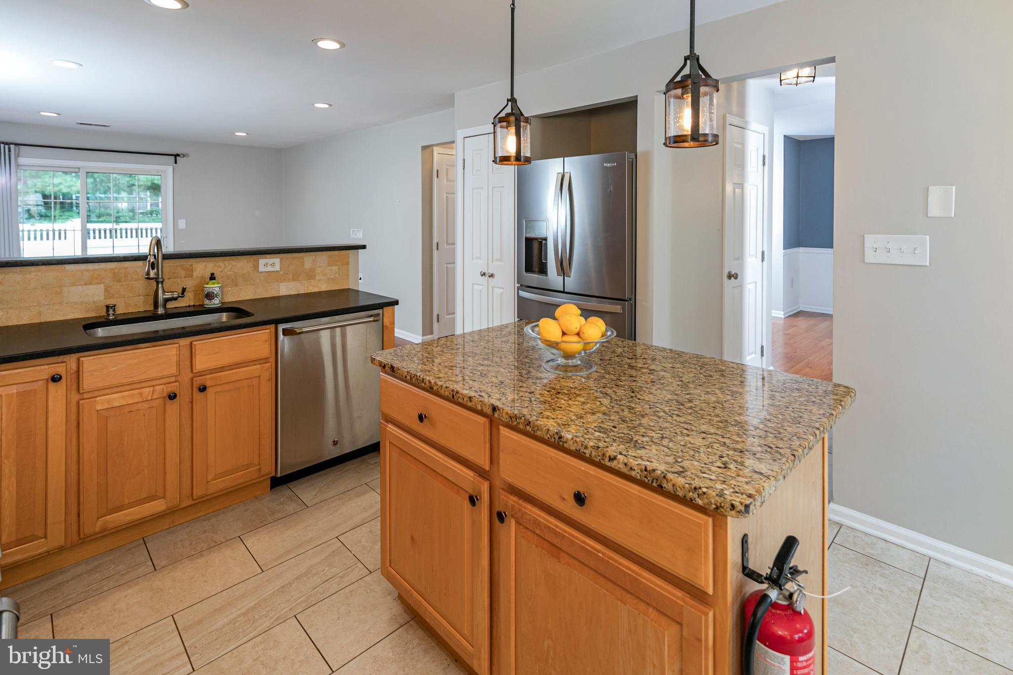 371 Watkins Road Pennington, NJ 08534 - Photo 14 of 42 a kitchen with stainless steel appliances granite countertop a sink and refrigerator