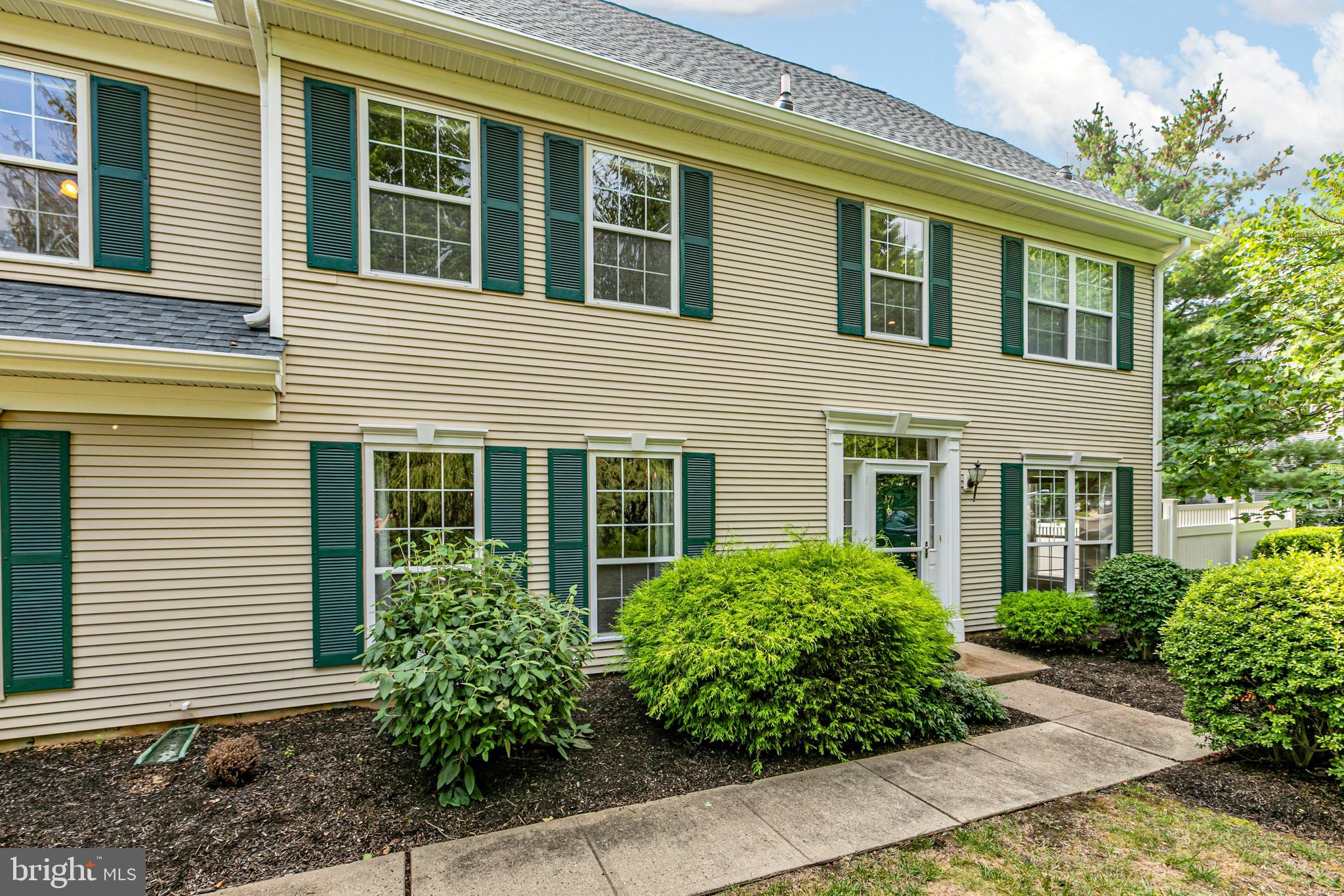 371 Watkins Road Pennington, NJ 08534 - Photo 2 of 42 a view of a house with potted plants and a bench