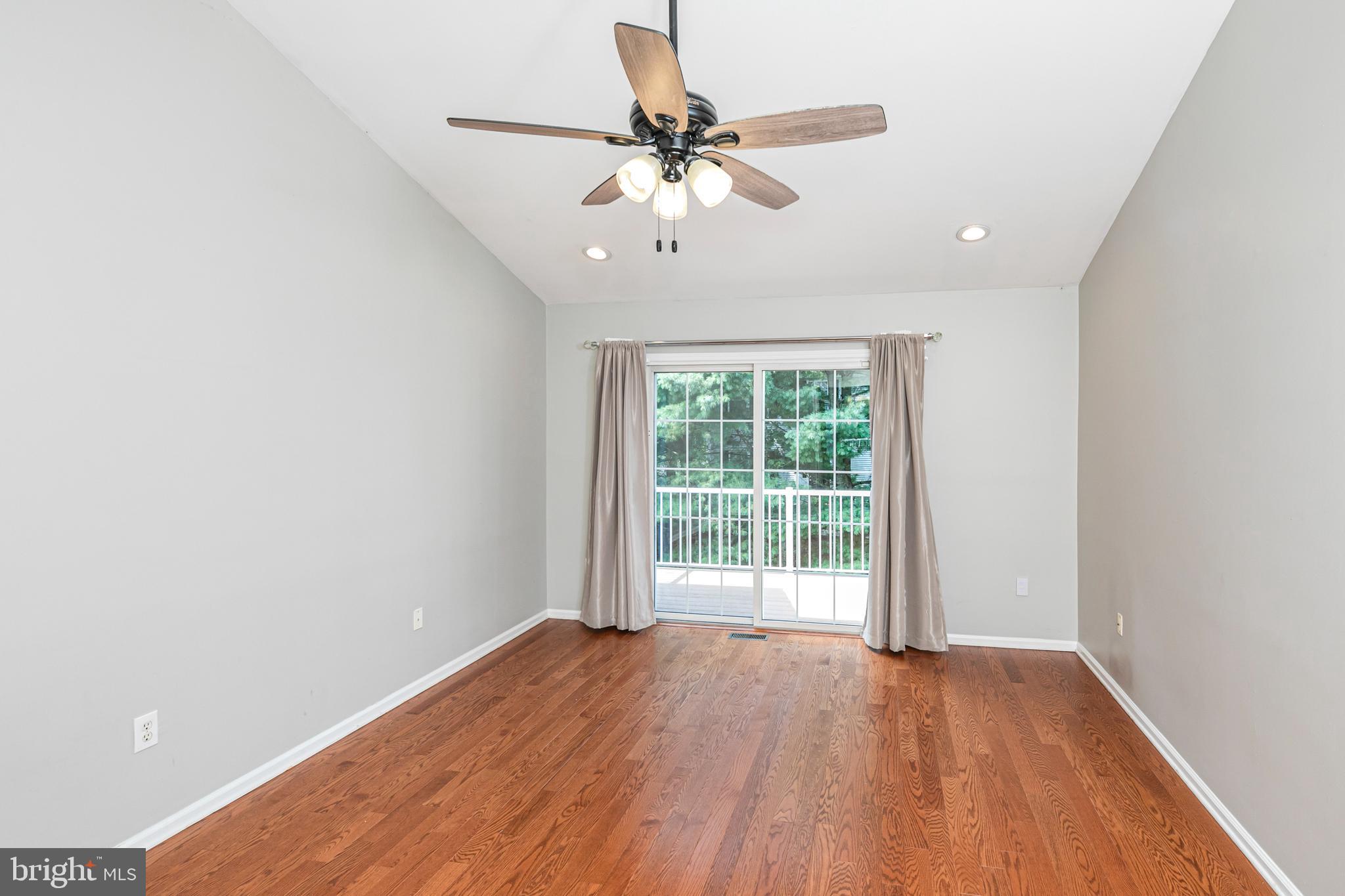371 Watkins Road Pennington, NJ 08534 - Photo 22 of 42 an empty room with wooden floor and windows