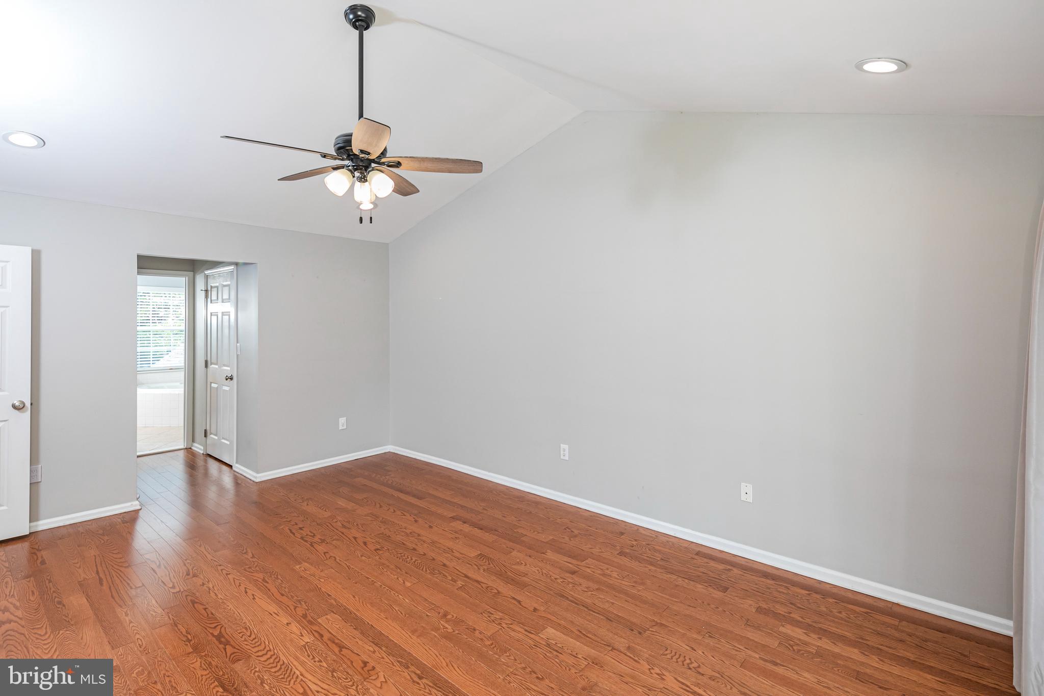 371 Watkins Road Pennington, NJ 08534 - Photo 24 of 42 a view of a room with wooden floor and a ceiling fan