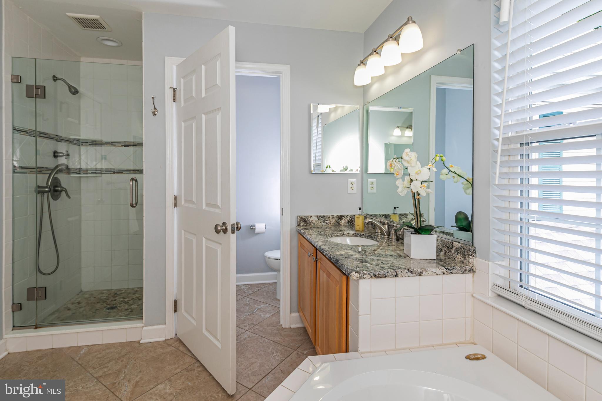 371 Watkins Road Pennington, NJ 08534 - Photo 27 of 42 a bathroom with a shower sink vanity and mirror