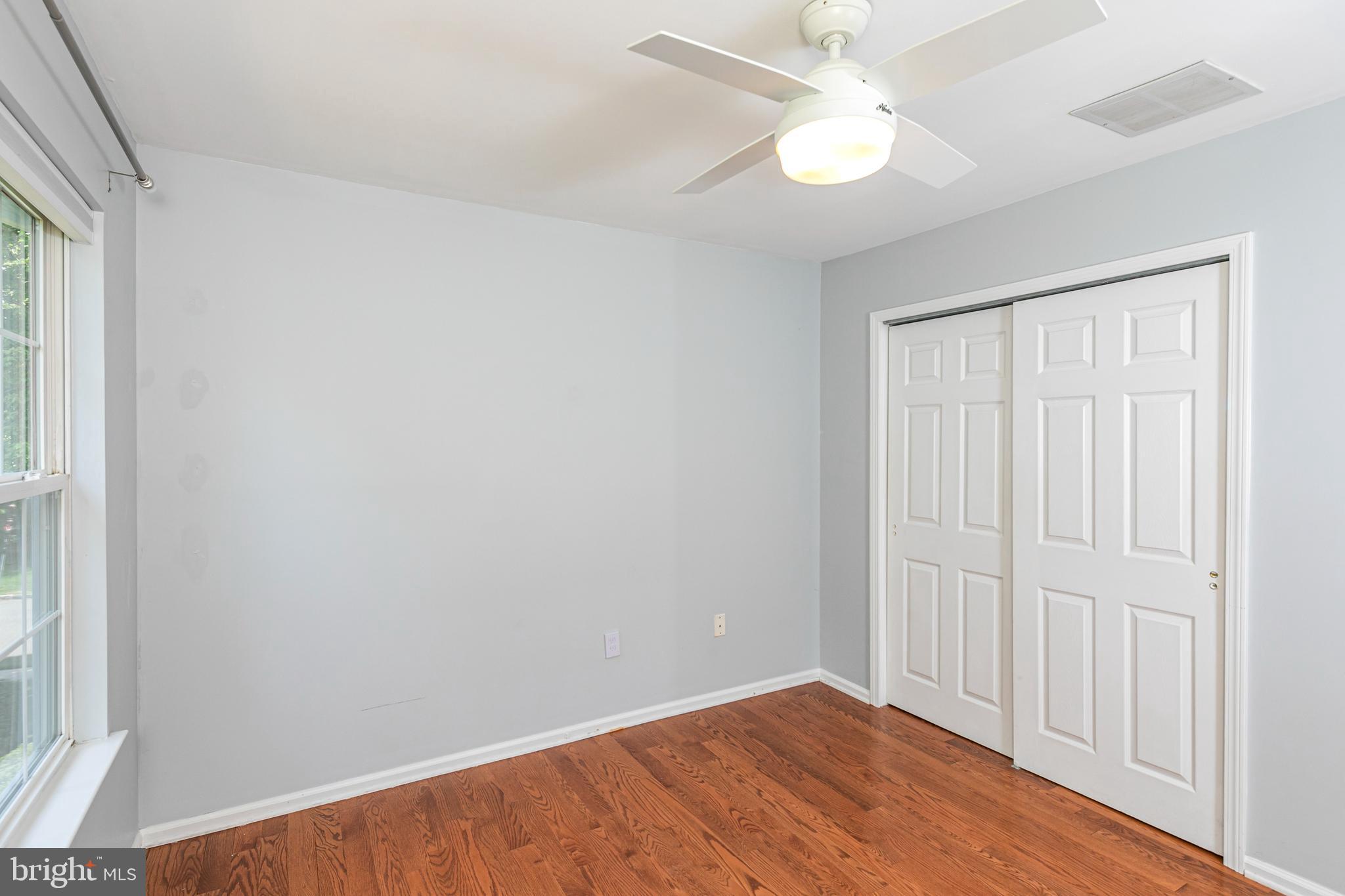 371 Watkins Road Pennington, NJ 08534 - Photo 31 of 42 an empty room with a window and a fan