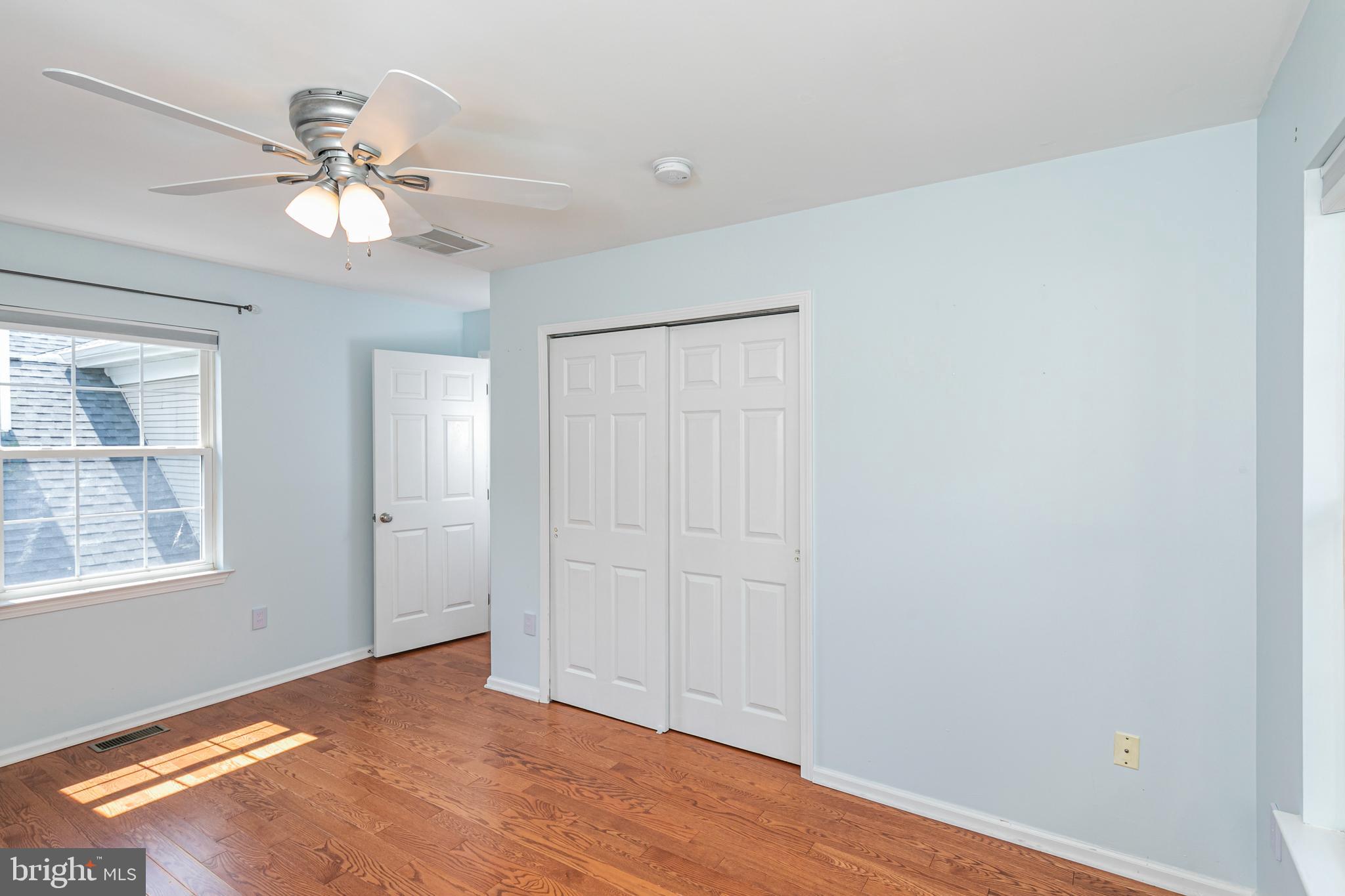 371 Watkins Road Pennington, NJ 08534 - Photo 33 of 42 a view of an empty room with wooden floor and a ceiling fan