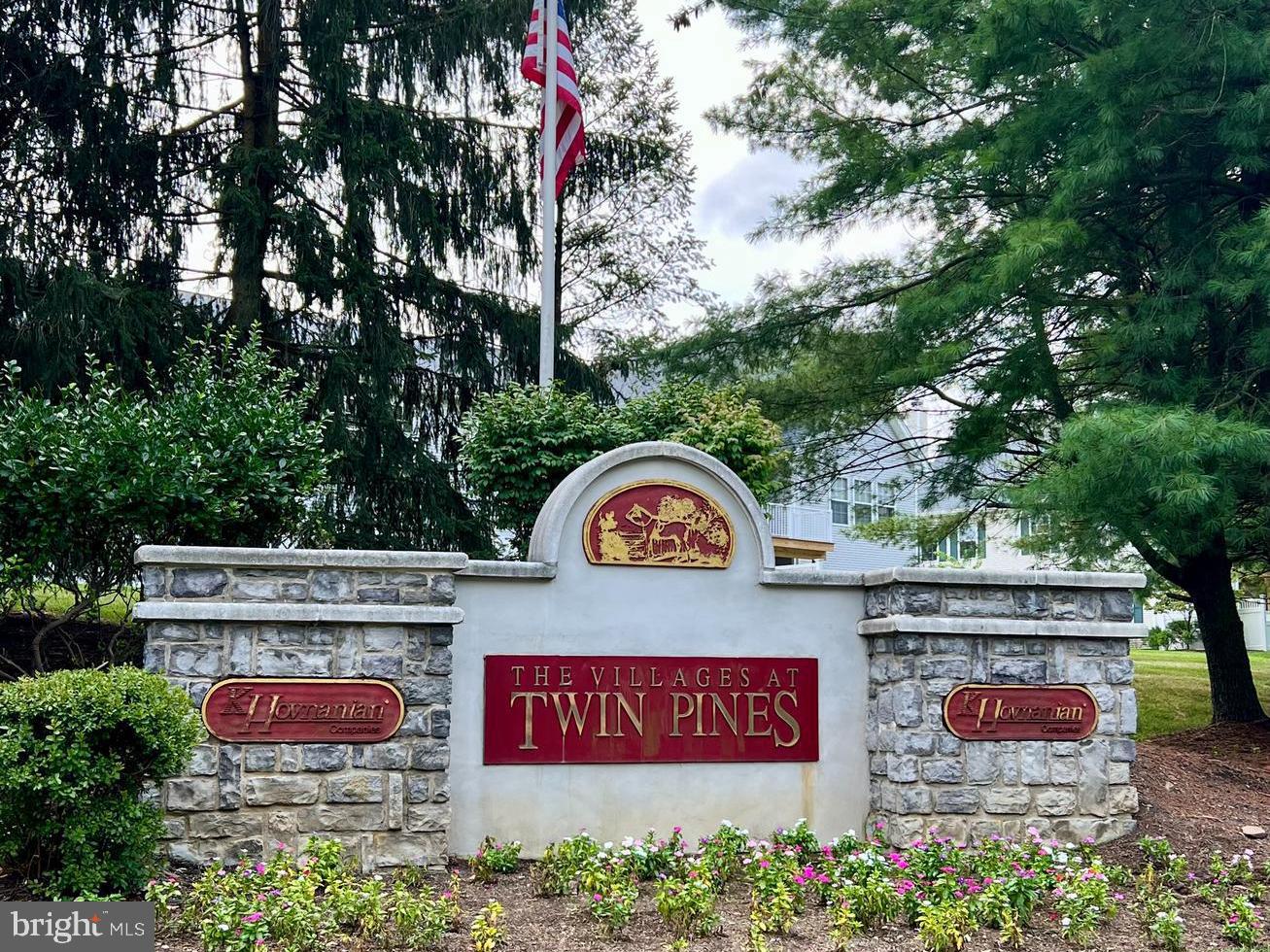 371 Watkins Road Pennington, NJ 08534 - Photo 42 of 42 a view of outdoor space with signage and flags