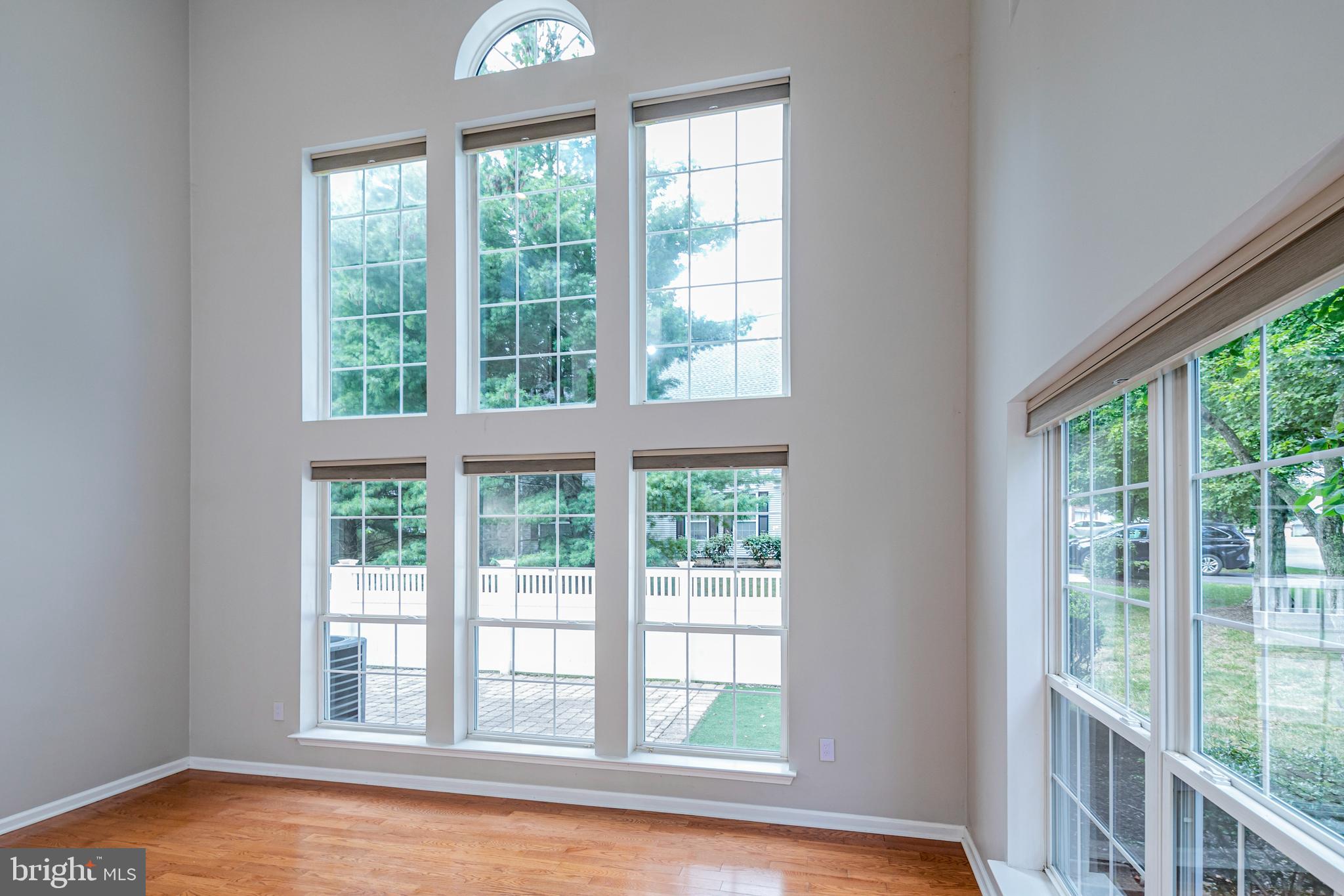 371 Watkins Road Pennington, NJ 08534 - Photo 6 of 42 a view of an empty room with wooden floor and a window