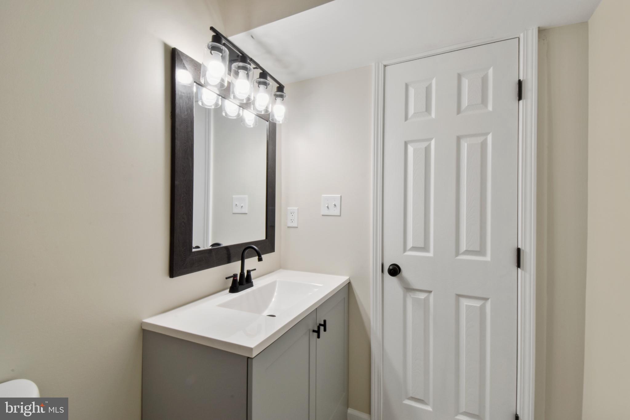 247 Hickory Road Front Royal, VA 22630 - Photo 17 of 46 a bathroom with a sink and a mirror
