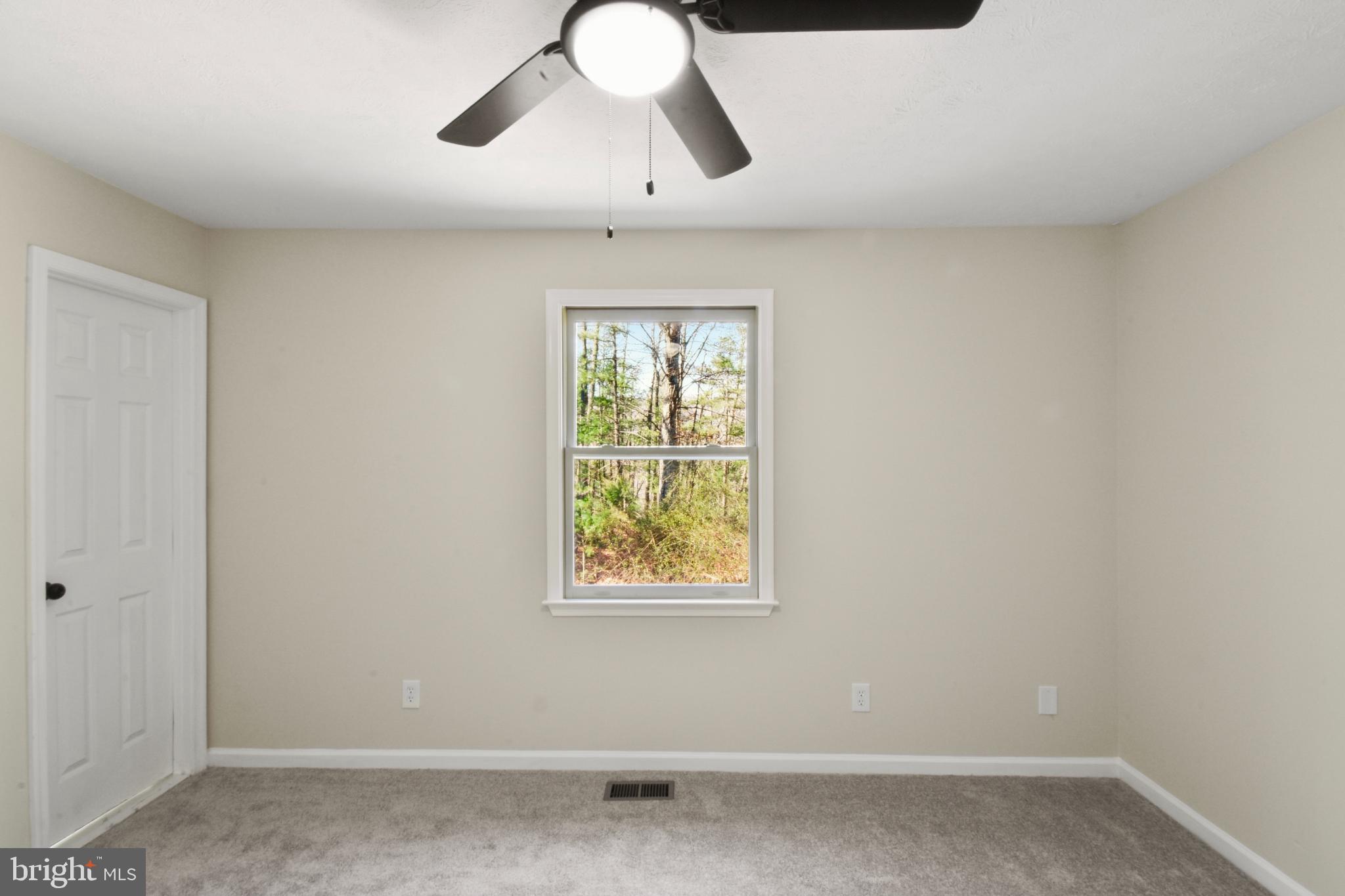 247 Hickory Road Front Royal, VA 22630 - Photo 19 of 46 wooden floor in an empty room with a window