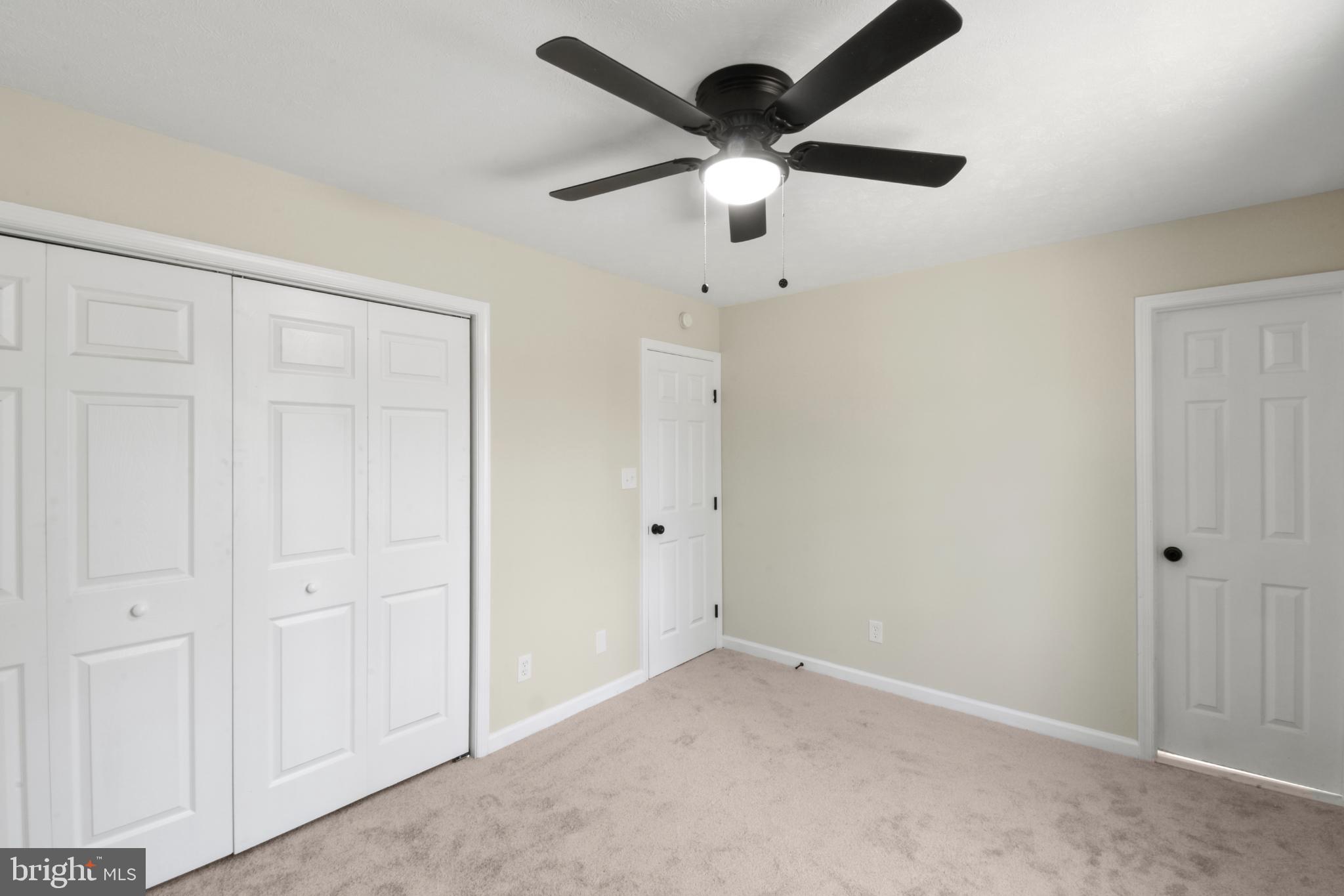 247 Hickory Road Front Royal, VA 22630 - Photo 20 of 46 an empty room with a ceiling fan and painted walls