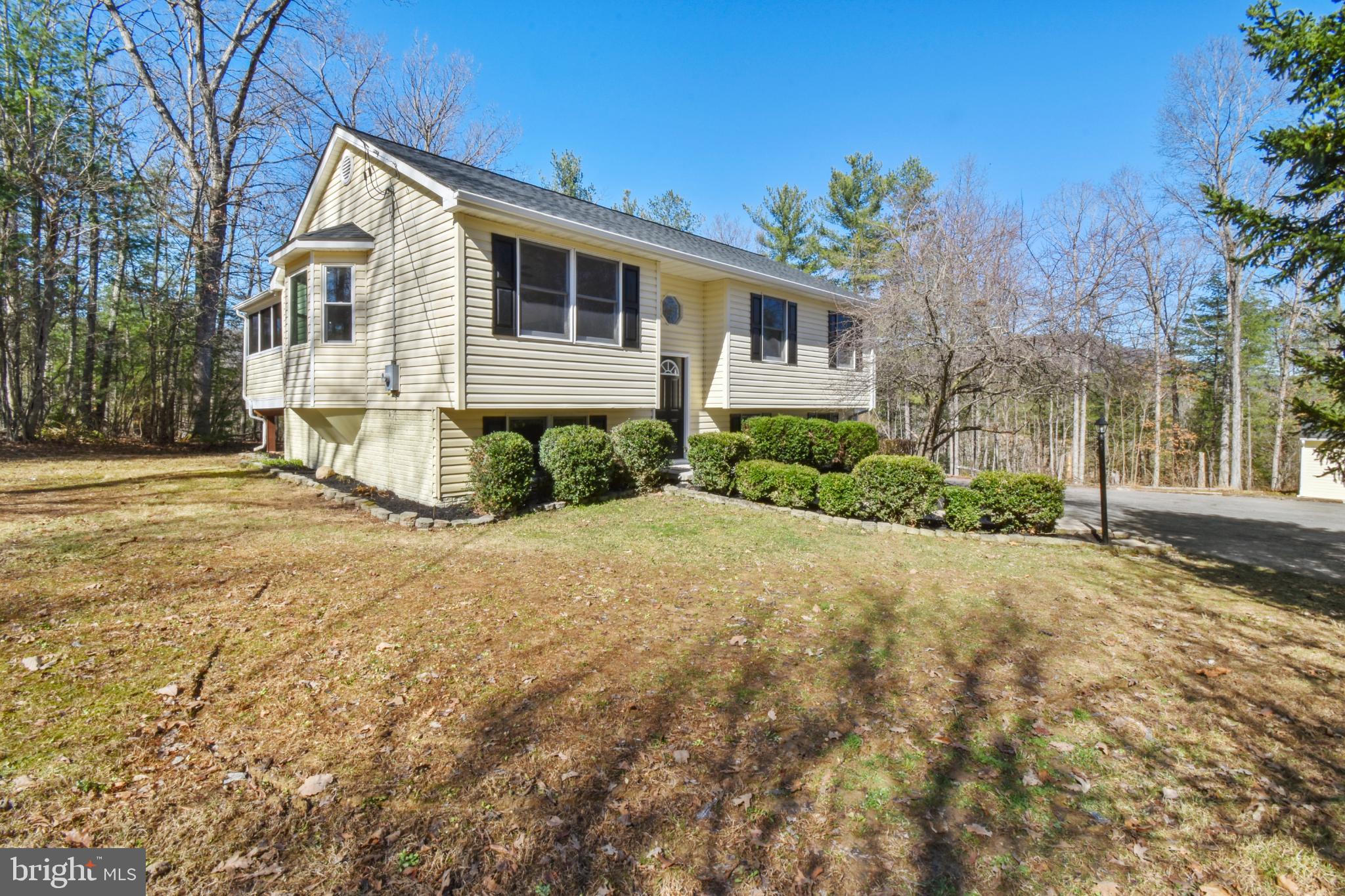 247 Hickory Road Front Royal, VA 22630 - Photo 2 of 46 a front view of a house with a yard and garage