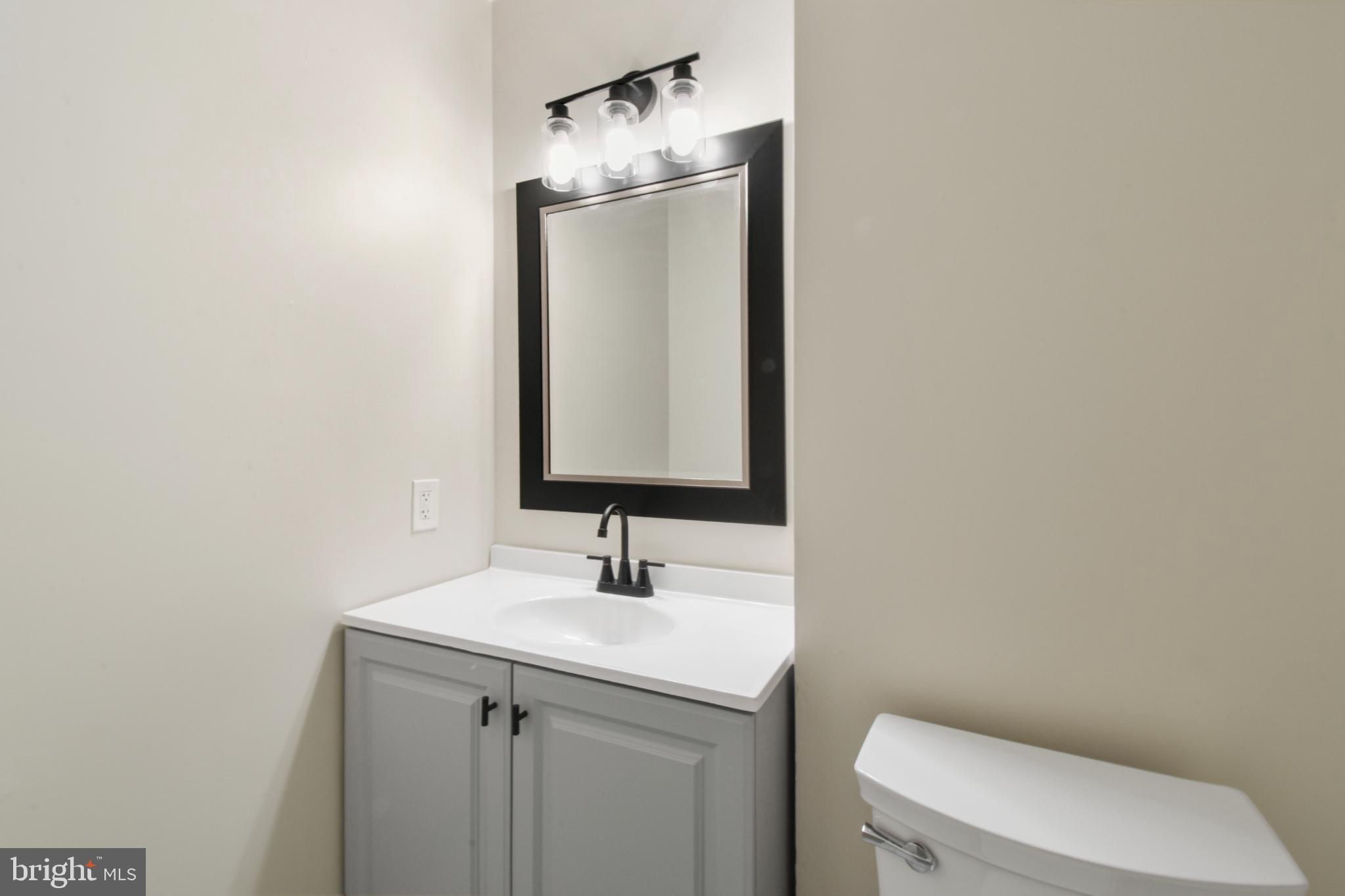 247 Hickory Road Front Royal, VA 22630 - Photo 28 of 46 a bathroom with a toilet sink and mirror