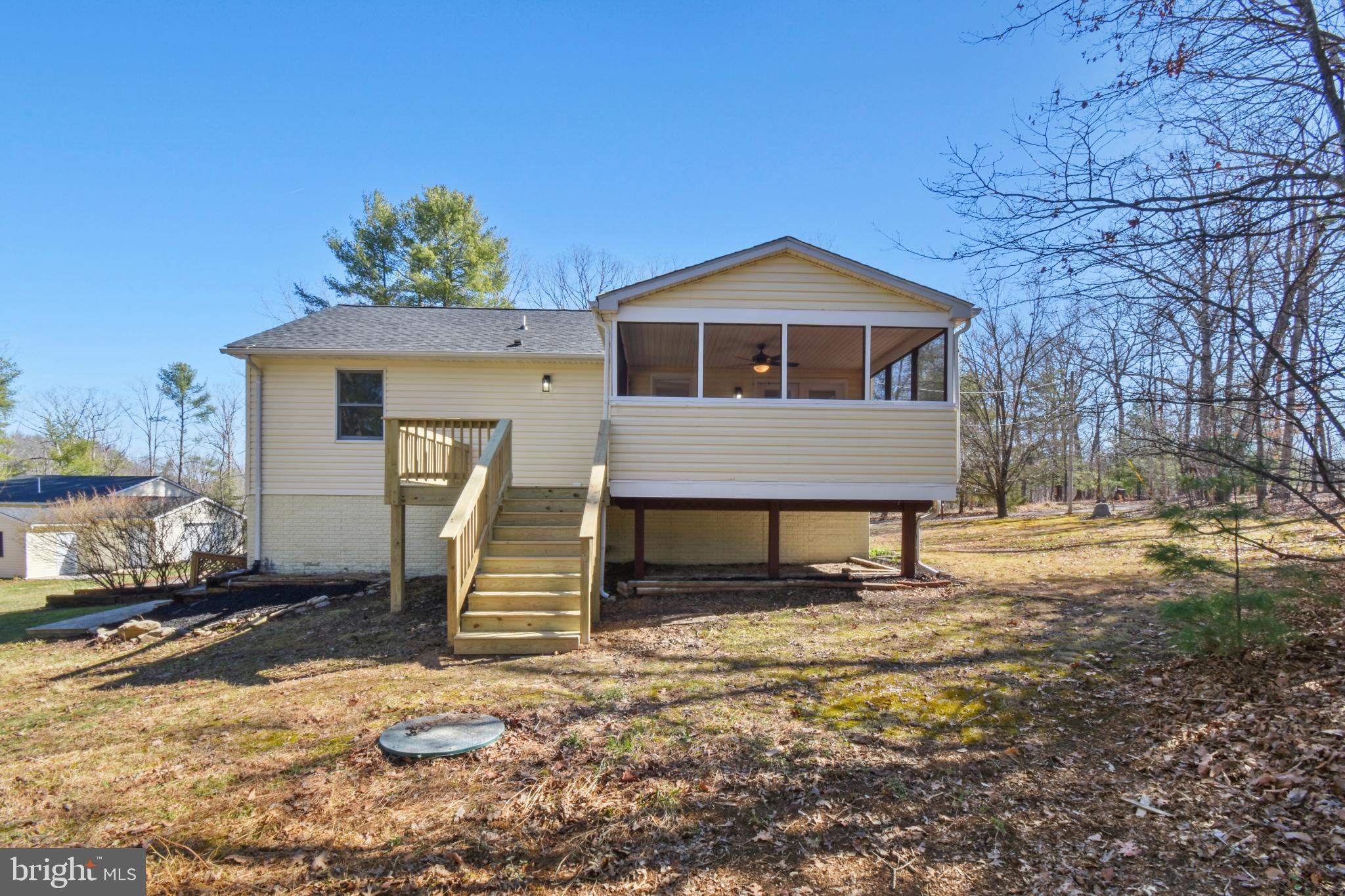 247 Hickory Road Front Royal, VA 22630 - Photo 4 of 46 a front view of a house with a yard