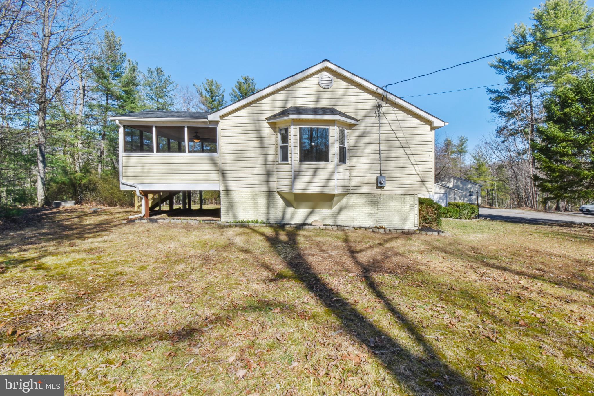 247 Hickory Road Front Royal, VA 22630 - Photo 7 of 46 a front view of a house with a yard