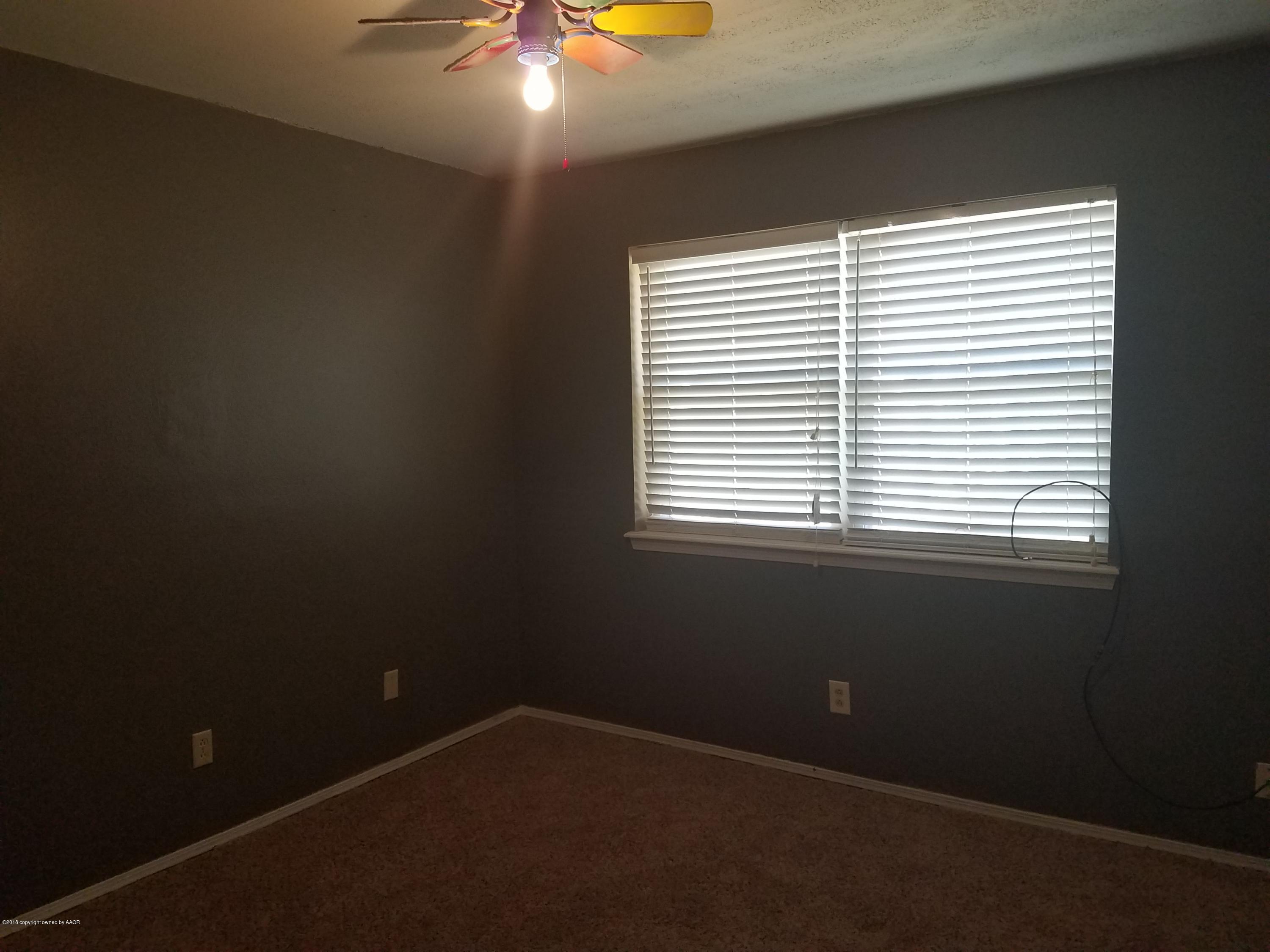 5114 Azalea Avenue Amarillo, TX 79110 - Photo 7 of 13 a view of an empty room with a window