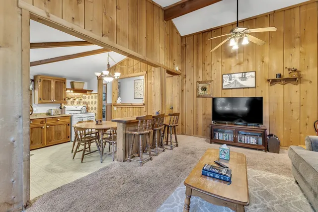 a living room with lots of furniture and a flat screen tv
