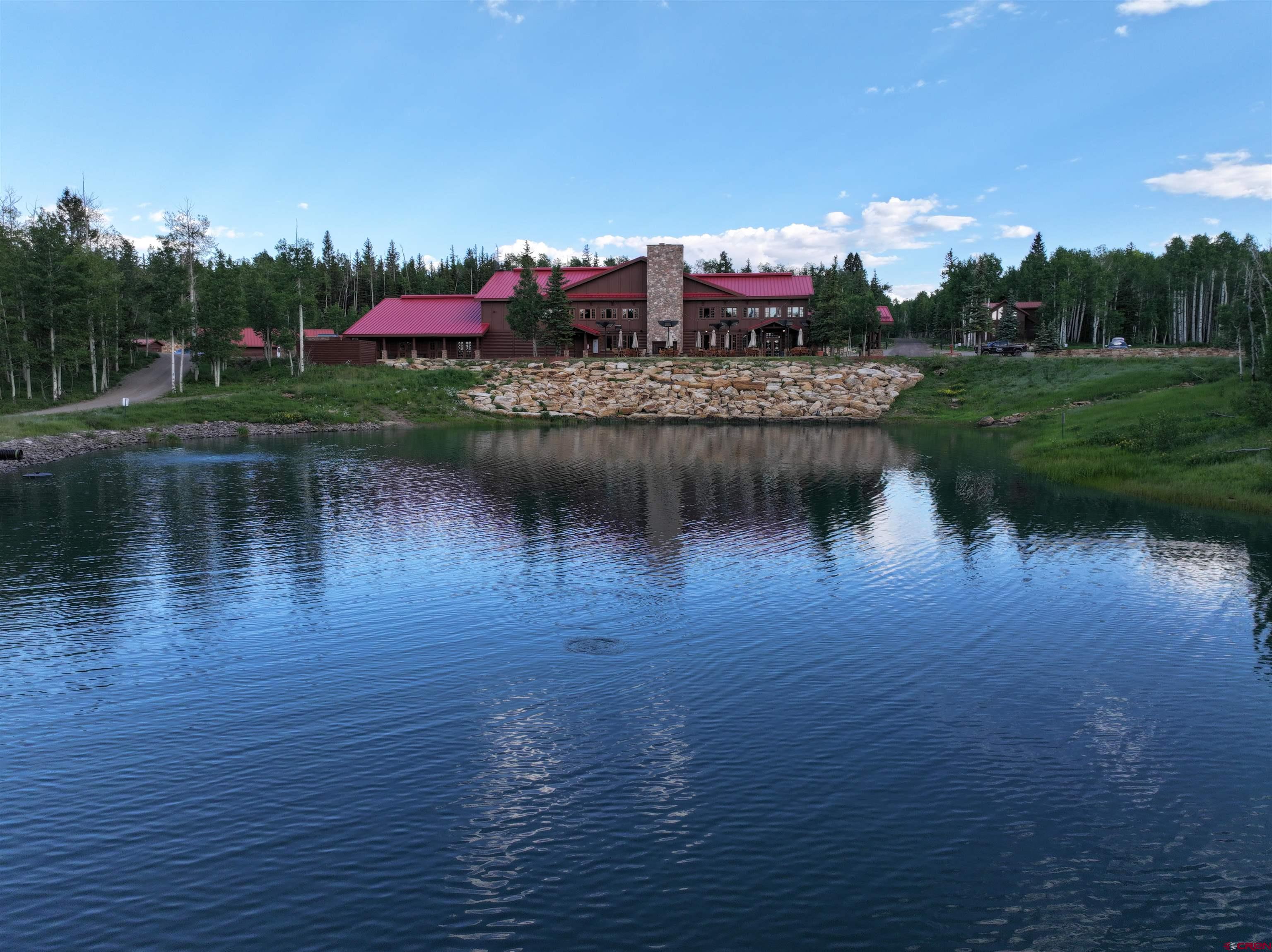 97 Elk Walk Road Montrose, CO 81403 - Photo 3 of 34 a view of a lake with houses